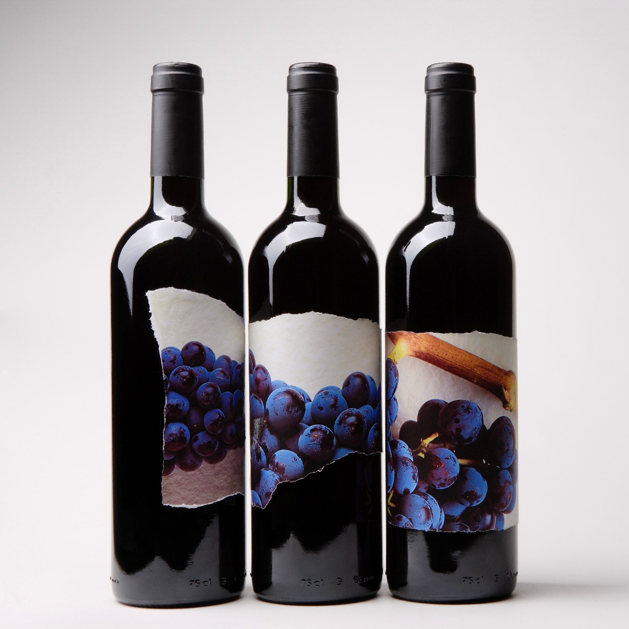 Three bottles of wine with Garnacha grape labels *** Local Caption *** 	